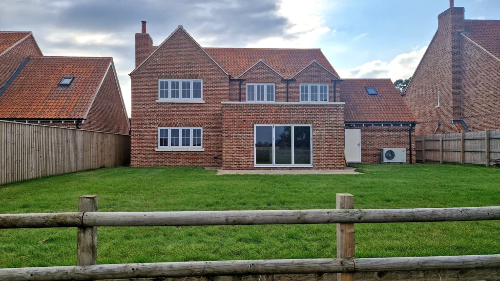 Completed new build house rear elevation in Helpringham Lincolnshire by KOG Building Projects Ltd with brick exterior and landscaped garden